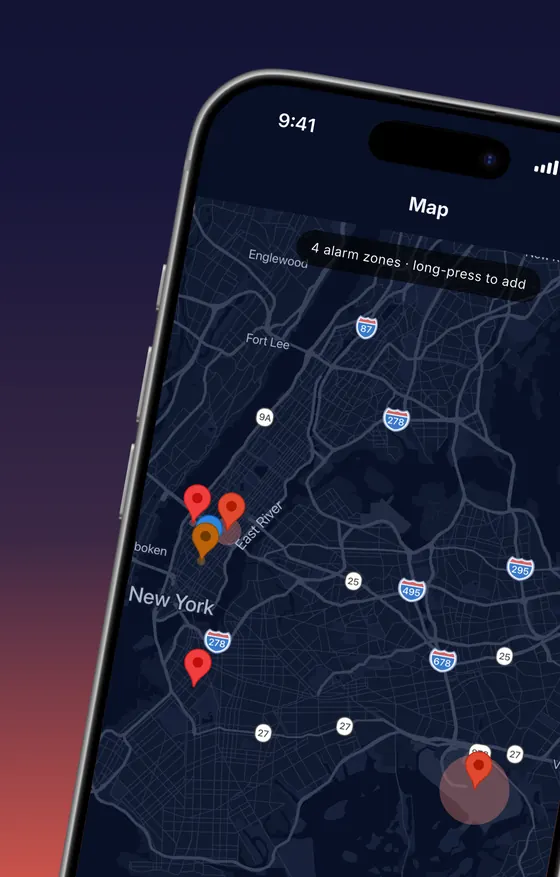 Map screen of New York with four alarm zone pins and a banner reading 4 alarm zones, long-press to add.